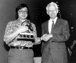 Claude Shannon awards Feng-Hsiung Hsu first prize for Deep Thought at the World Computer Chess Championship in Edmonton, Alberta